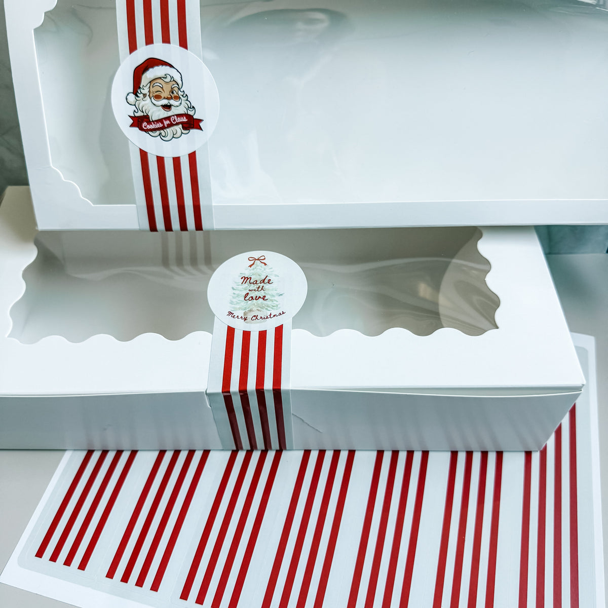 Red stripe and Santa Wrap & Seal stickers for sealing and decorating cookie and bakery packaging.