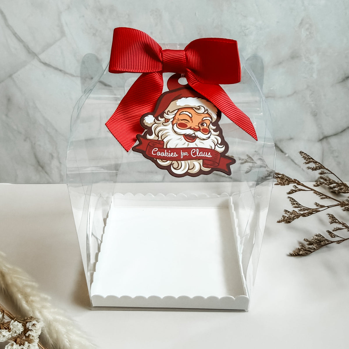 Clear gable carry cookie box with a built-in handle and white scalloped base